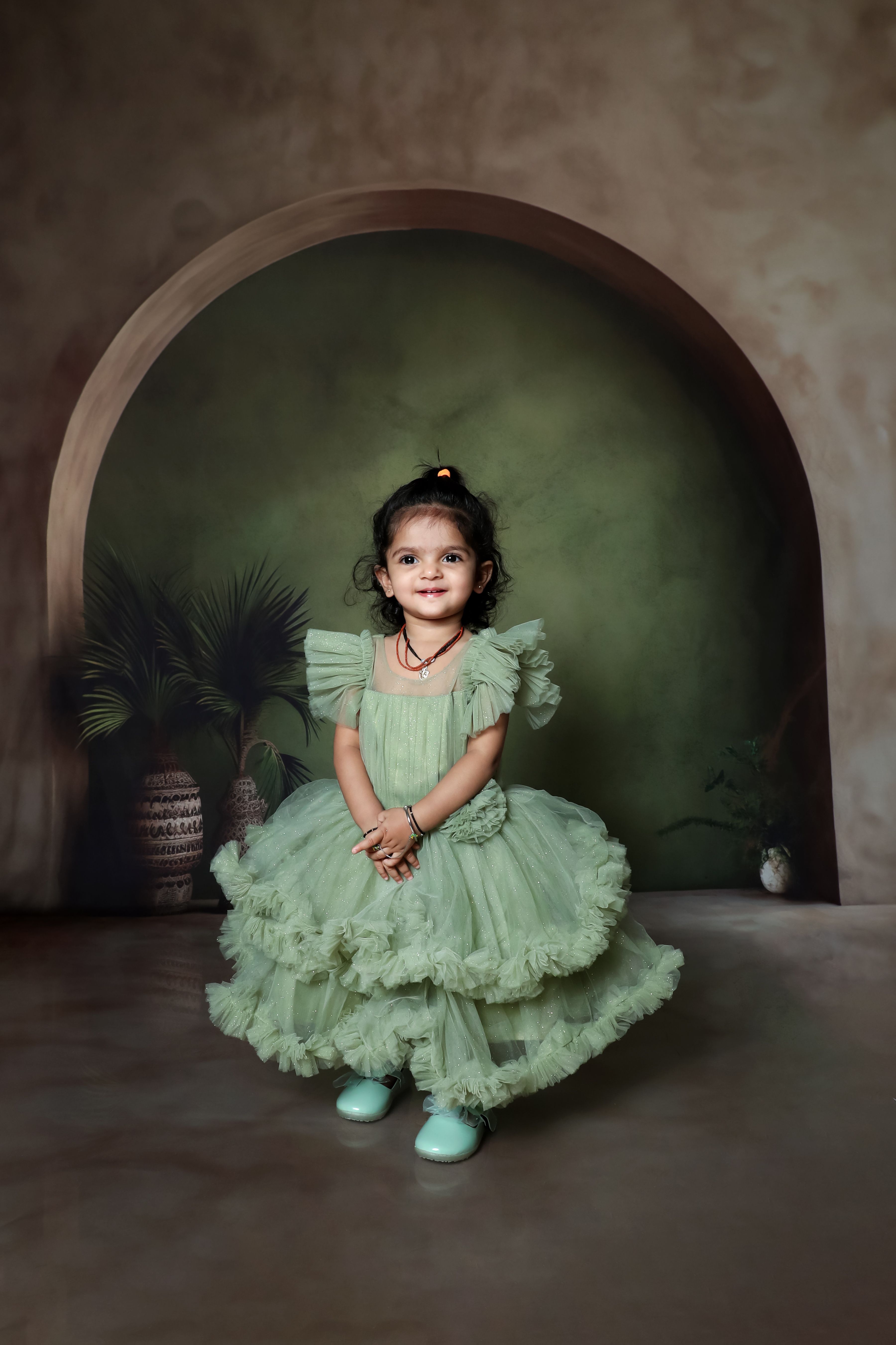 Charming Child in Elegant Green Dress Portrait  Free Stock Photo