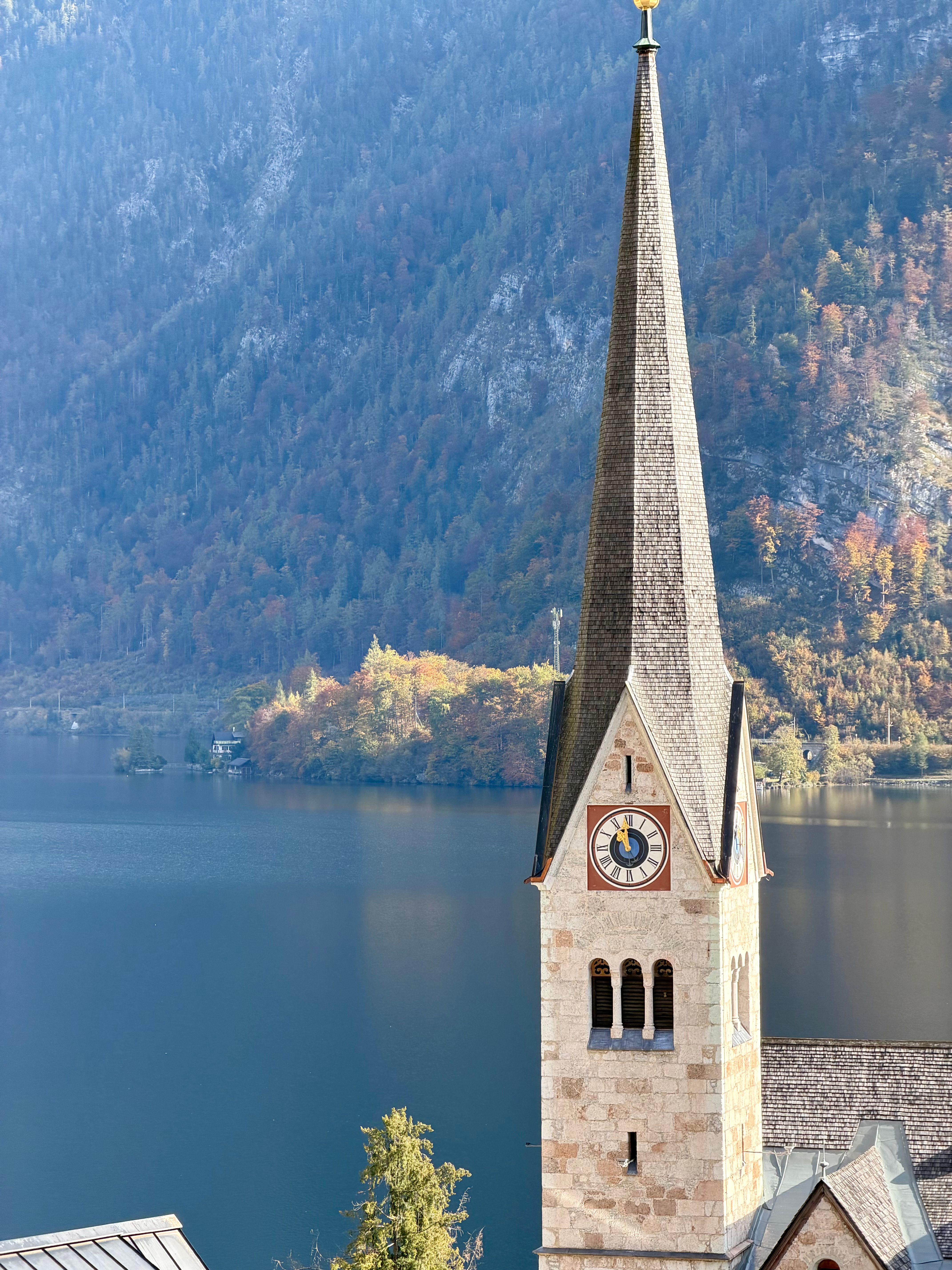 Iconic Hallstatt Church Tower by Alpine Lake · Free Stock Photo
