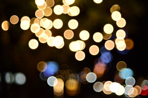 Free A mesmerizing abstract bokeh display of blurred lights in a night scene. Stock Photo
