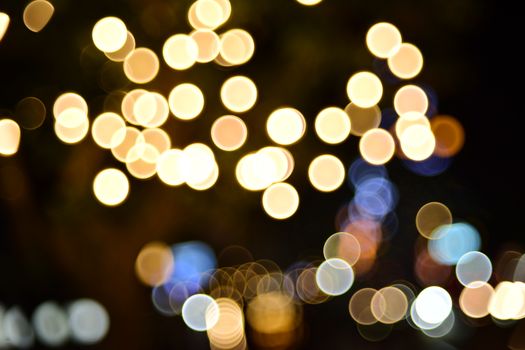 A mesmerizing display of abstract bokeh light circles captured at night, creating a dreamy atmosphere.