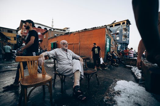 A vibrant street scene at Damietta's fish market with people interacting outdoors.