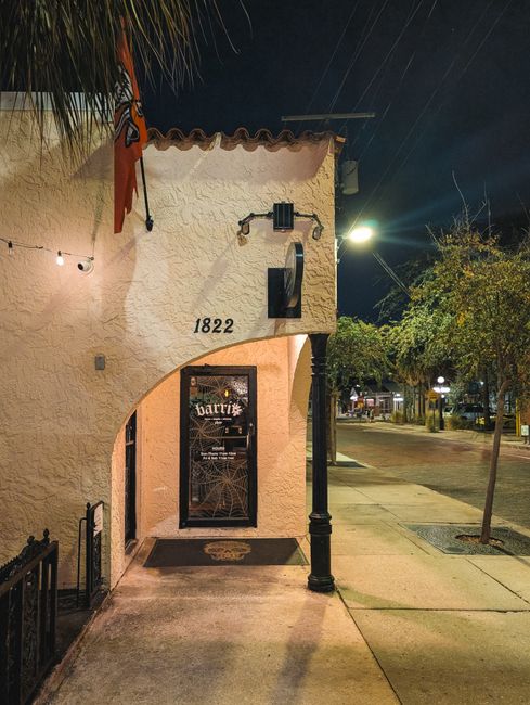 Street view in Ybor City, Tampa with classic architecture at night. Discover urban charm.