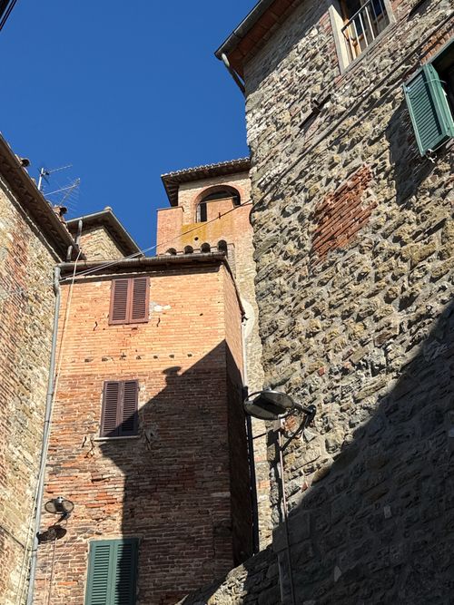 Free Charming rustic Italian stone buildings under a vivid blue sky. Stock Photo