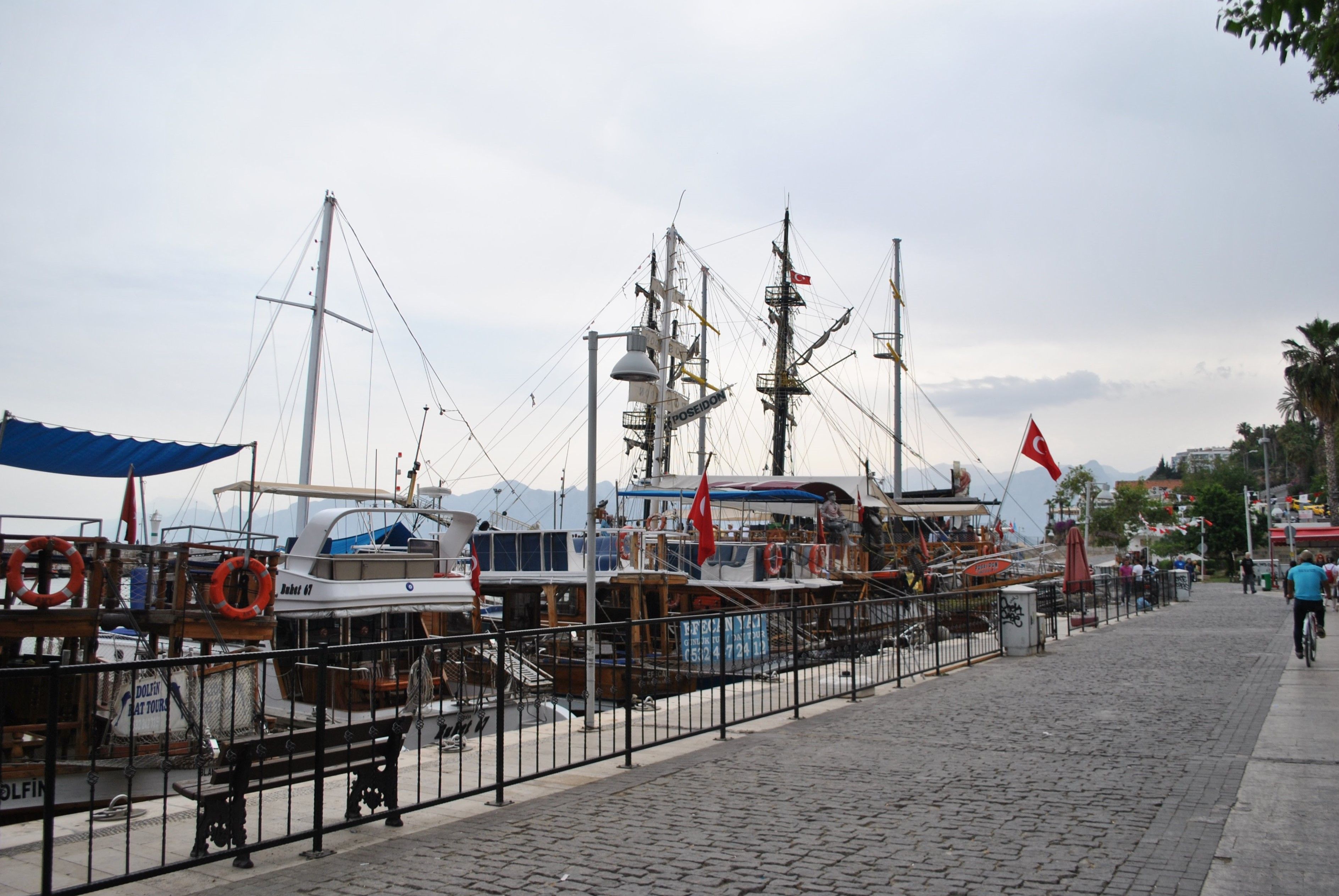 Outstanding Private Luxury Yacht Sunset Cruise in Bodrum with Dinner 3 Hours Review 2026 - Scenic view of boats docked along the Antalya harbor promenade in Turkey during the day.