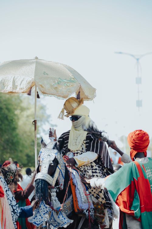 Free Colorful display of African culture with ornate costumes and horse. Stock Photo