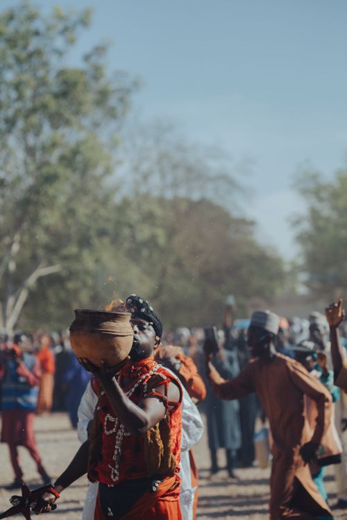 Free Celebration of African heritage with cultural rituals and traditional attire outdoors. Stock Photo