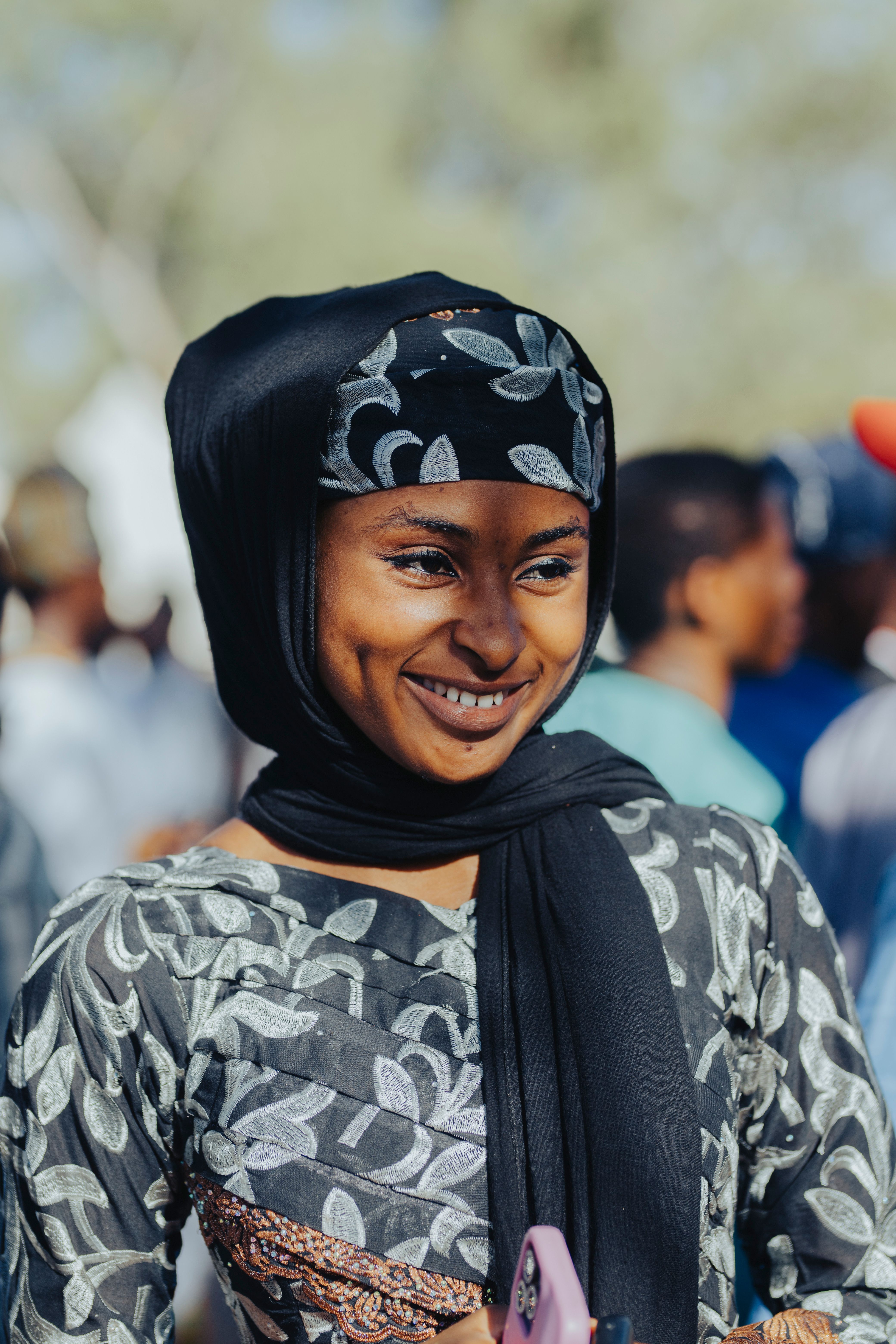 Smiling Woman in Traditional Attire at Outdoor Event · Free Stock Photo