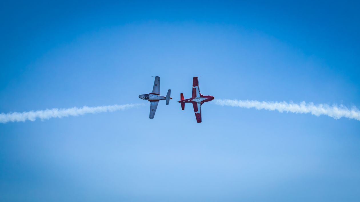 Stunning Aerial Display with Two Aerobatic Planes · Free Stock Photo