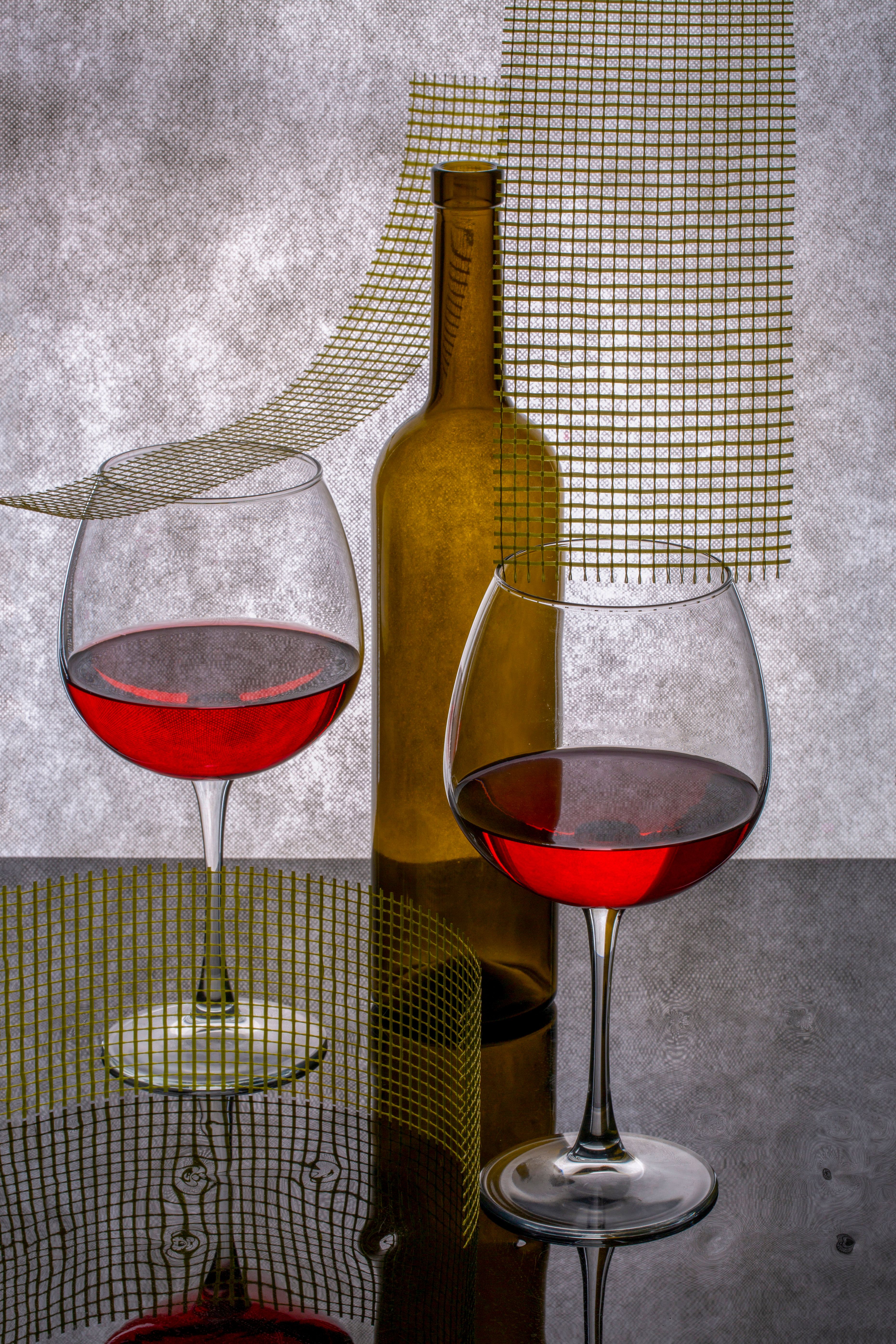 Artistic Still Life of Wine Glasses and Bottle · Free Stock Photo