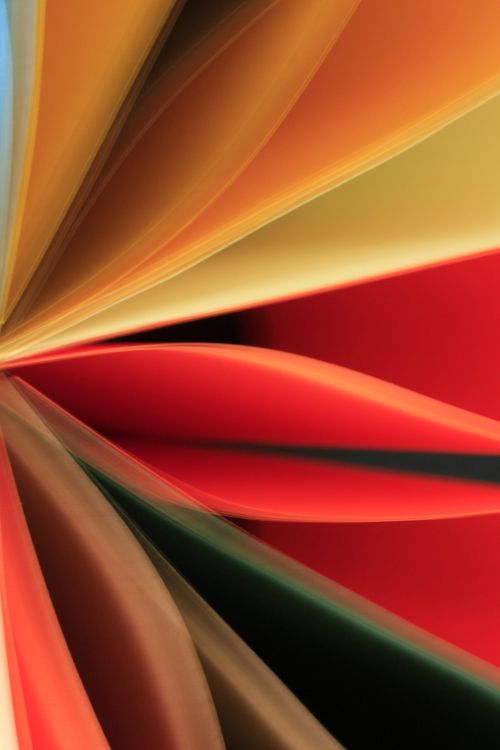 Free Vibrant abstract art featuring folded paper in various colors creating dynamic shapes and lines. Stock Photo