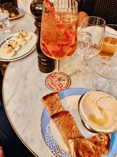 Free Tasty brunch spread featuring toast, deviled eggs, and a refreshing cocktail. Stock Photo