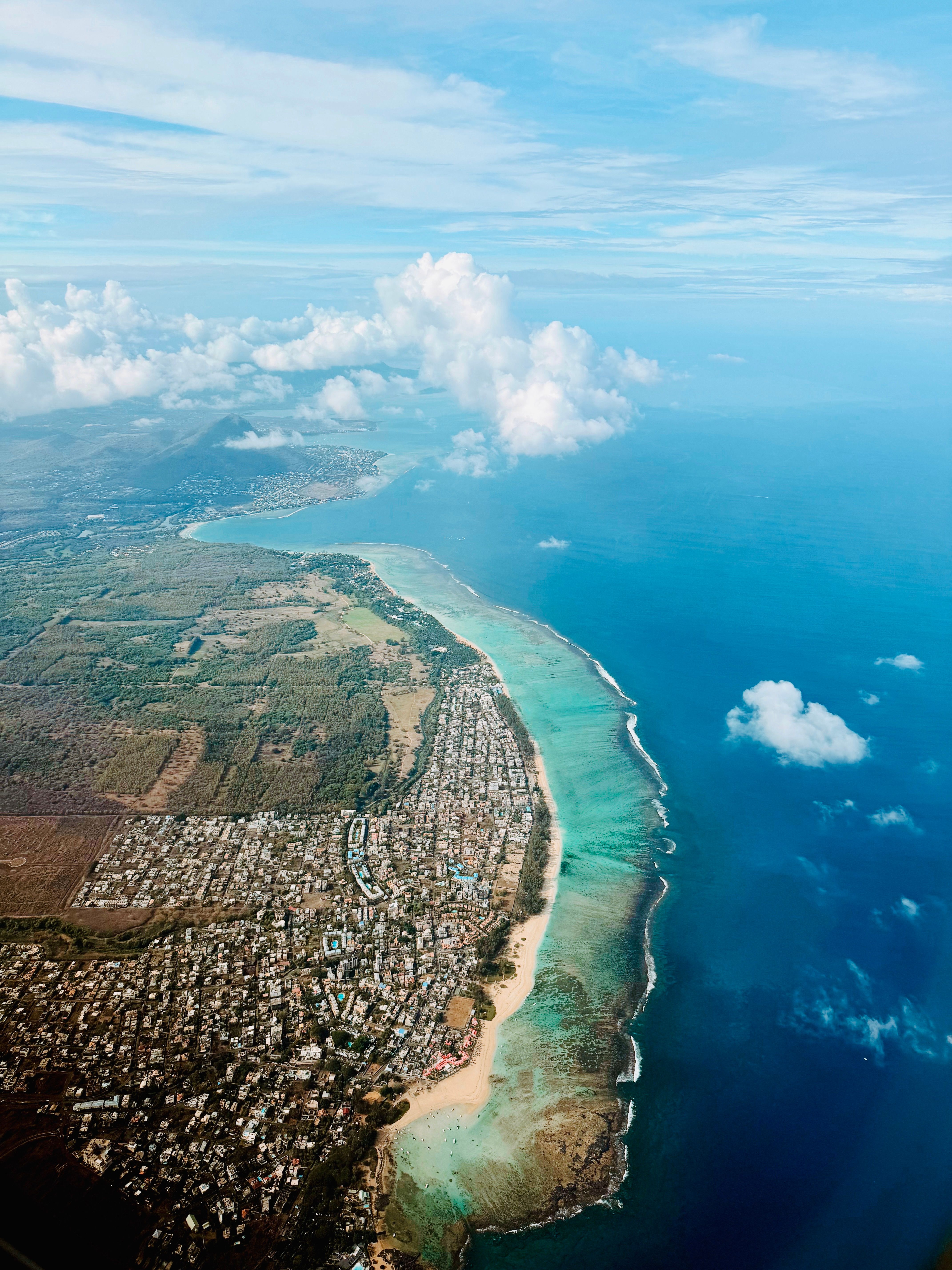 Aerial View of Tropical Coastal City and Ocean · Free Stock Photo