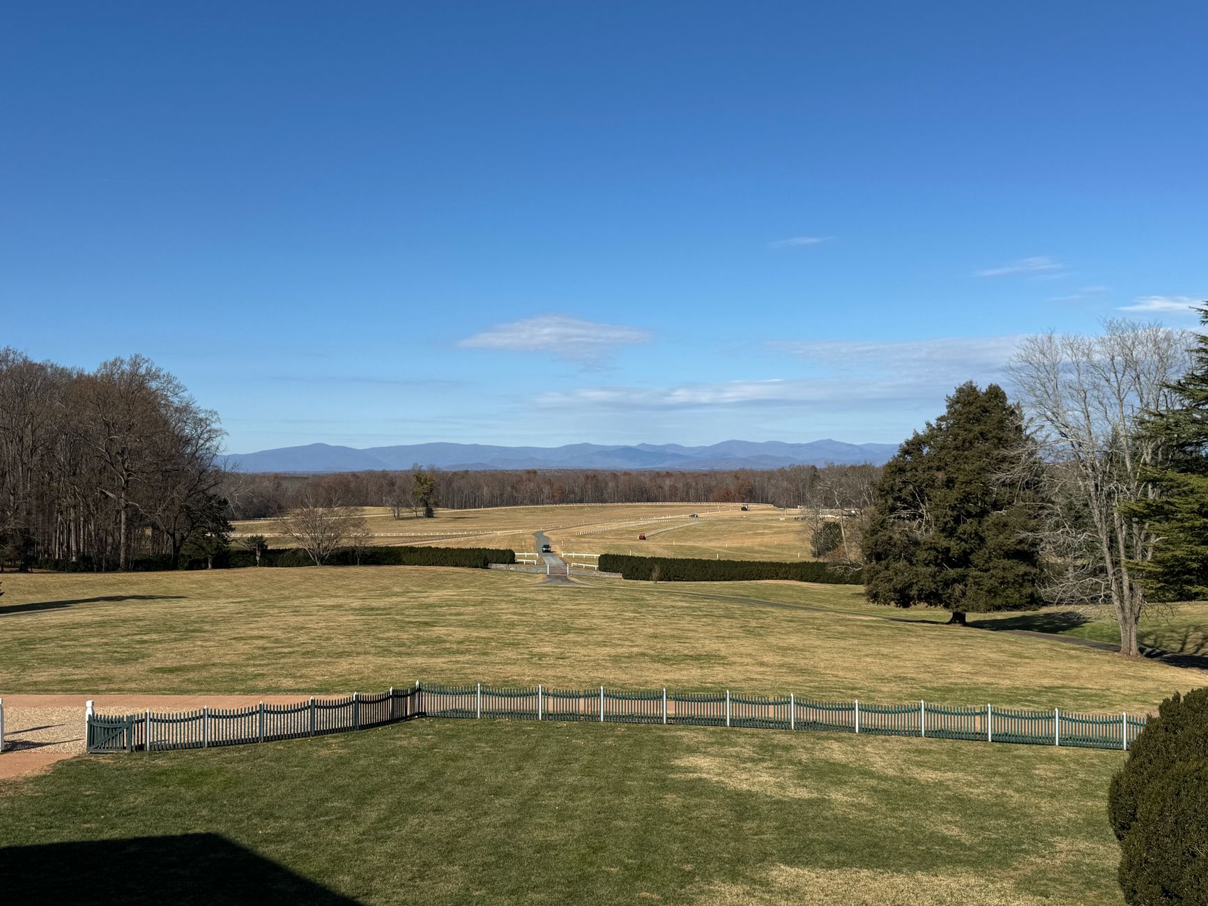 A peaceful landscape view from Montpelier with distant mountain scenery under a clear blue sky.