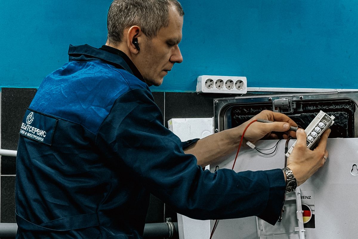 Technician repairing an appliance