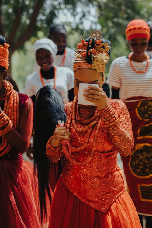 Free Vibrant African wedding ceremony with women in traditional attire and beadwork. Stock Photo