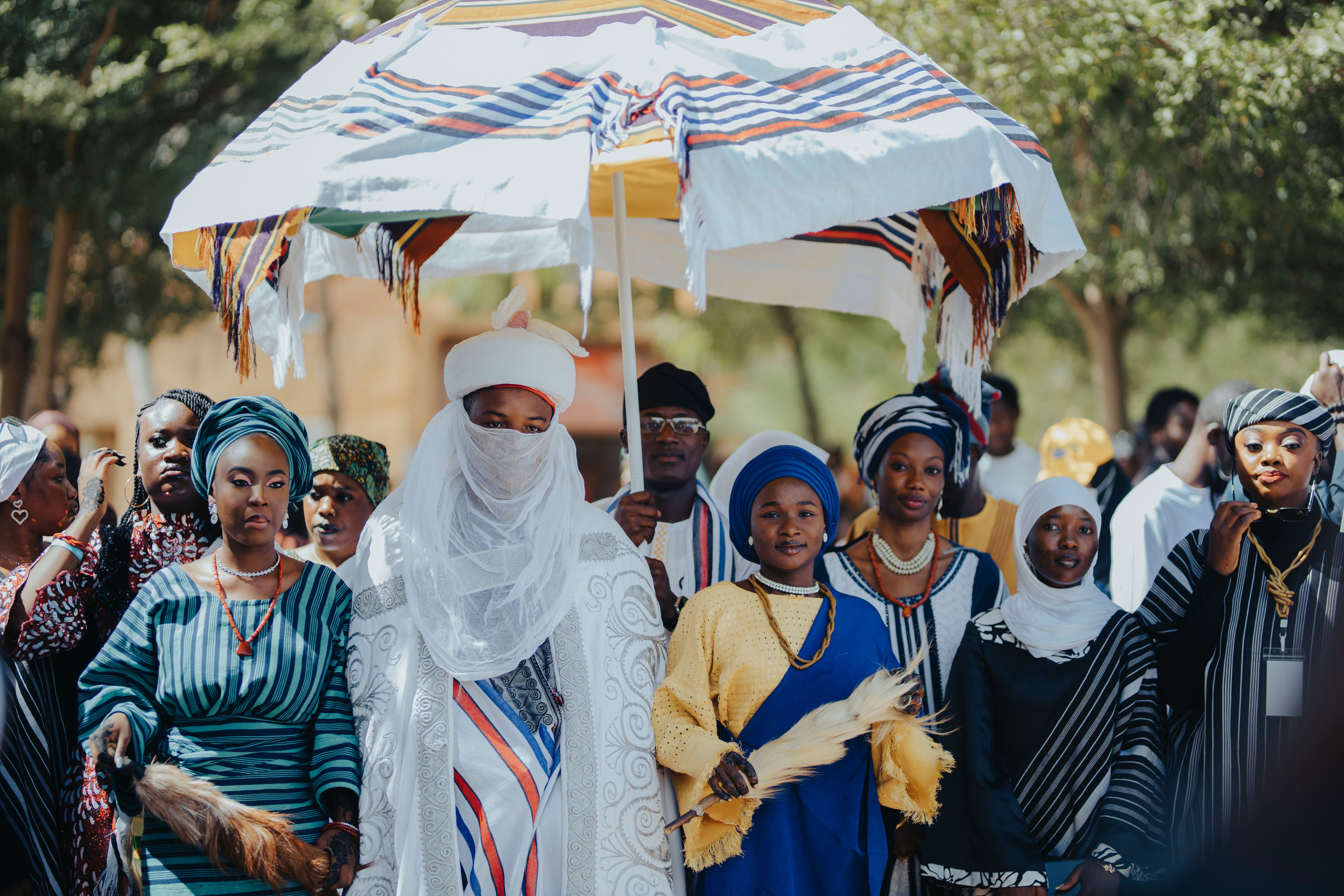 Traditional African Ceremony with Vibrant Attire · Free Stock Photo