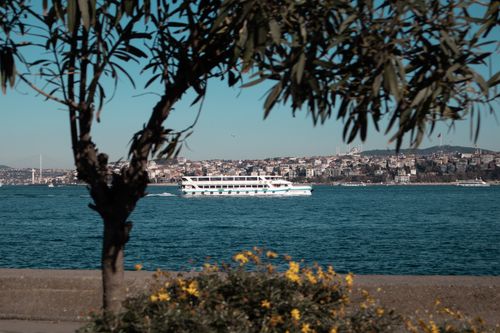 Free A serene view of the Bosphorus with a ferry, capturing the essence of Istanbul's maritime culture. Stock Photo