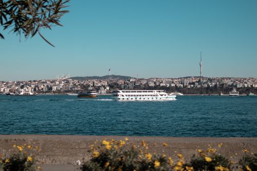 Free A scenic daytime view of Istanbul's Bosphorus Strait with ferry boats and city skyline. Stock Photo