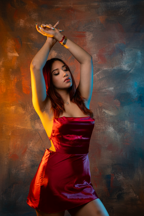 Elegant Woman Posing in Red Dress Studio Portrait · Free Stock Photo