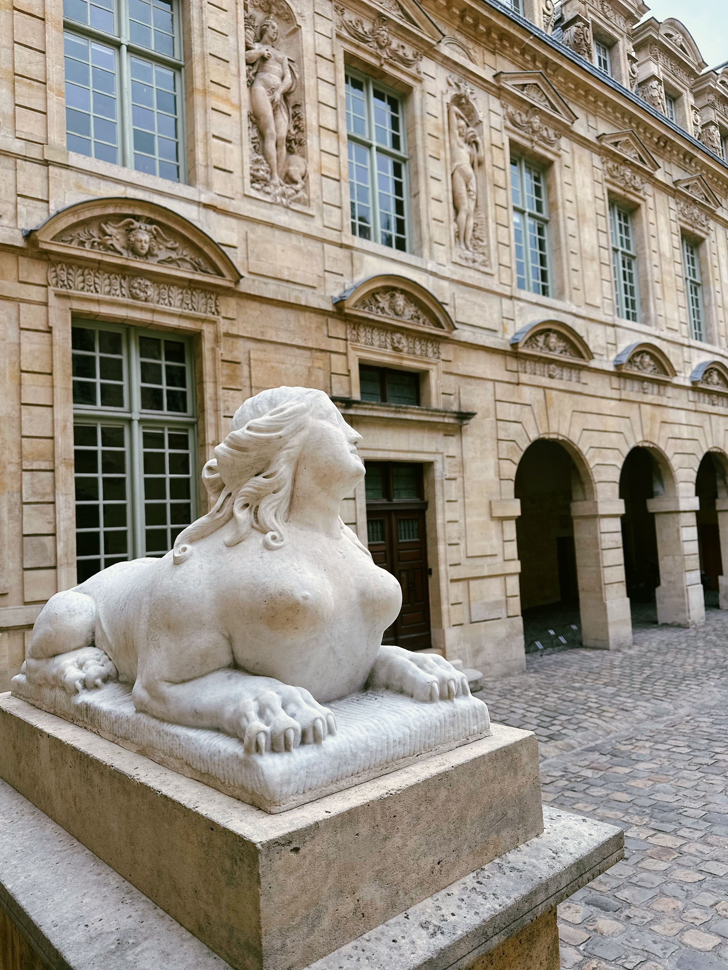 Classic European Architecture with Stone Sculpture · Free Stock Photo