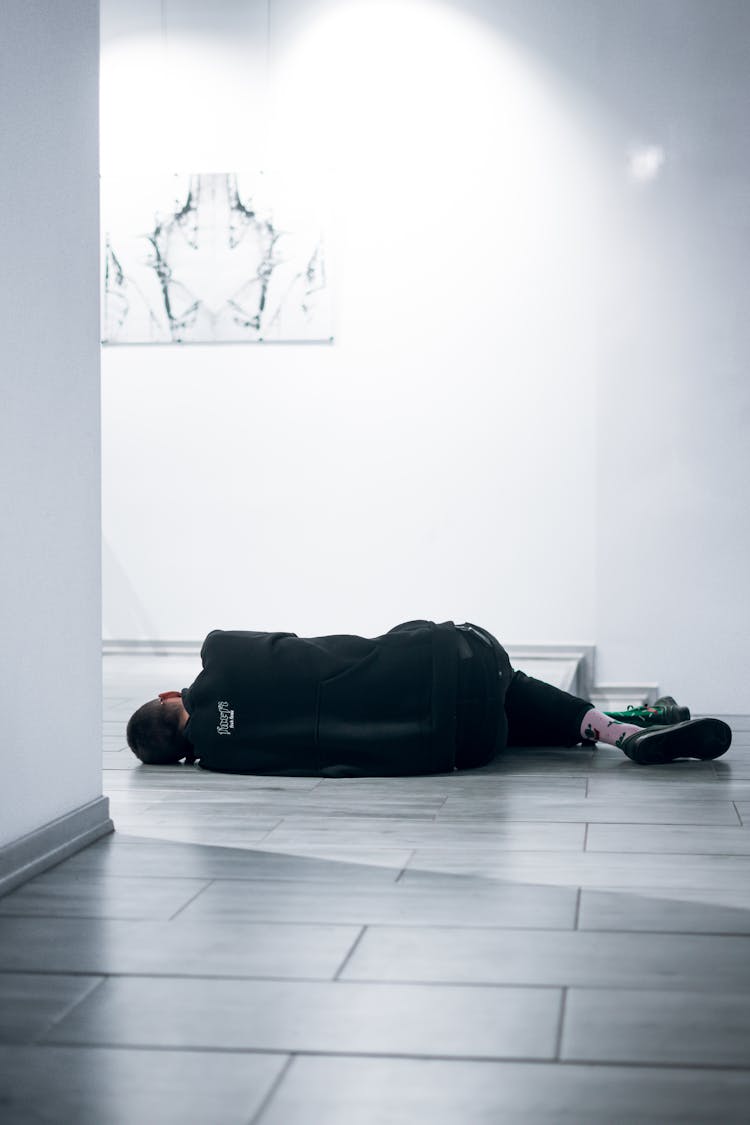 Man Lying On Floor