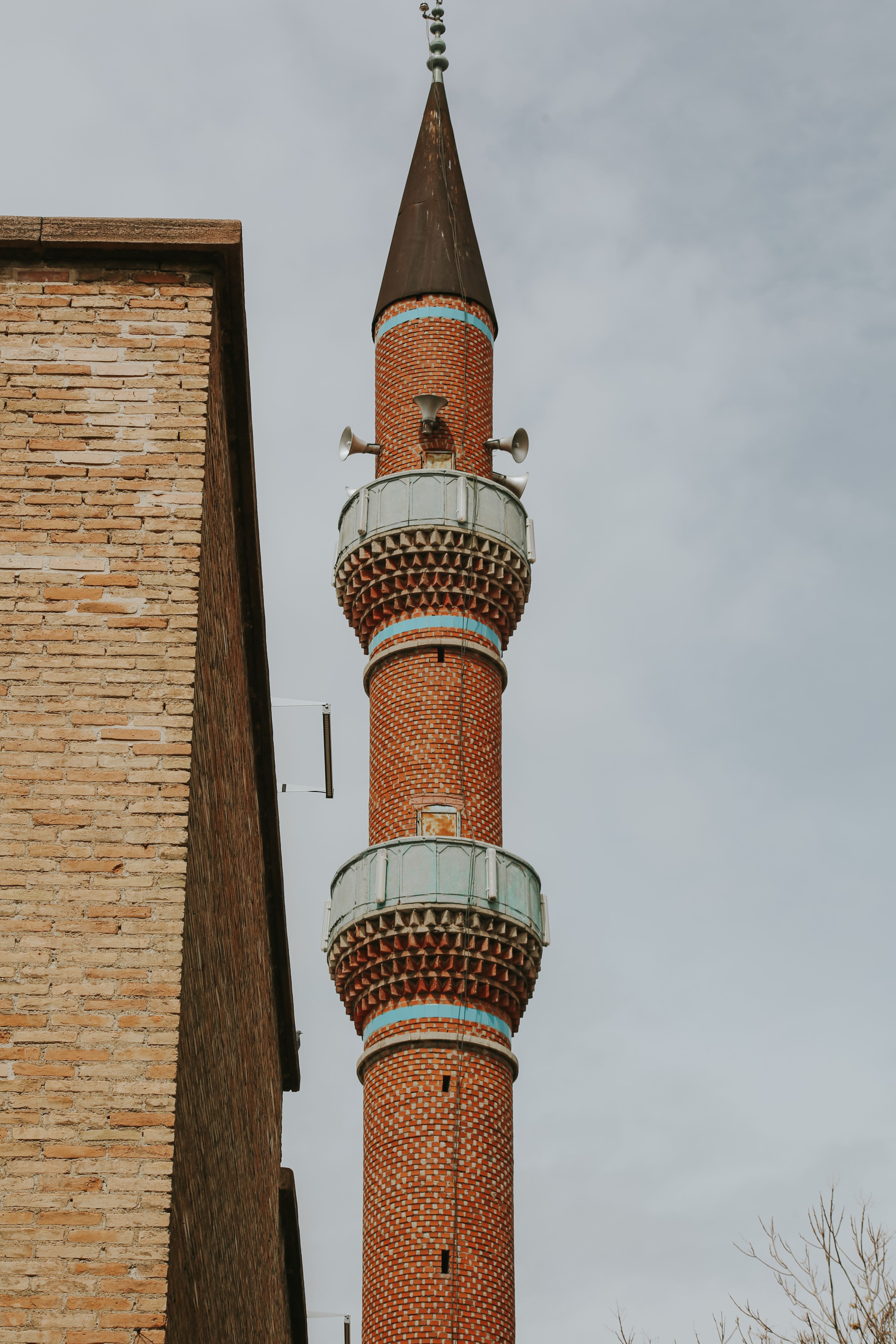 Minaret and Brickwork against Cloudy Sky · Free Stock Photo