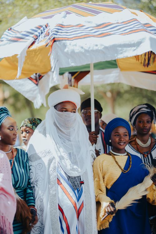 Free A group of people in colorful traditional African attire during a cultural ceremony. Stock Photo