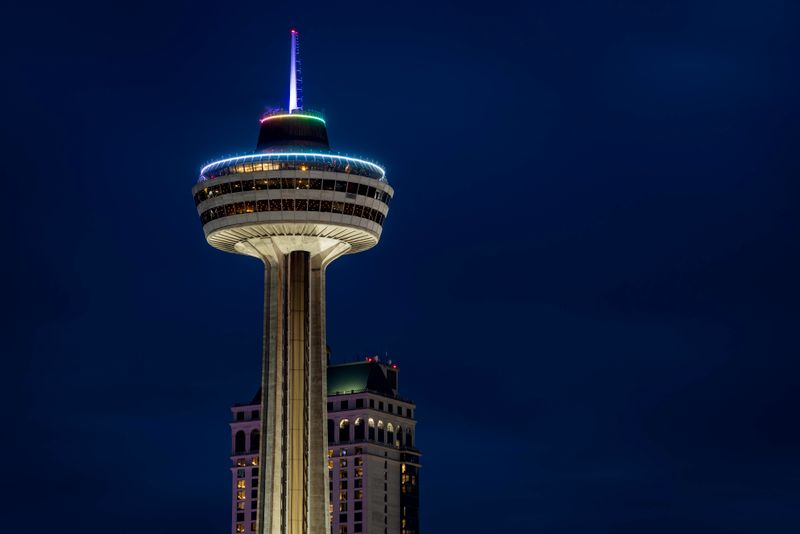 Skylon Tower Niagara lit against dark night sky