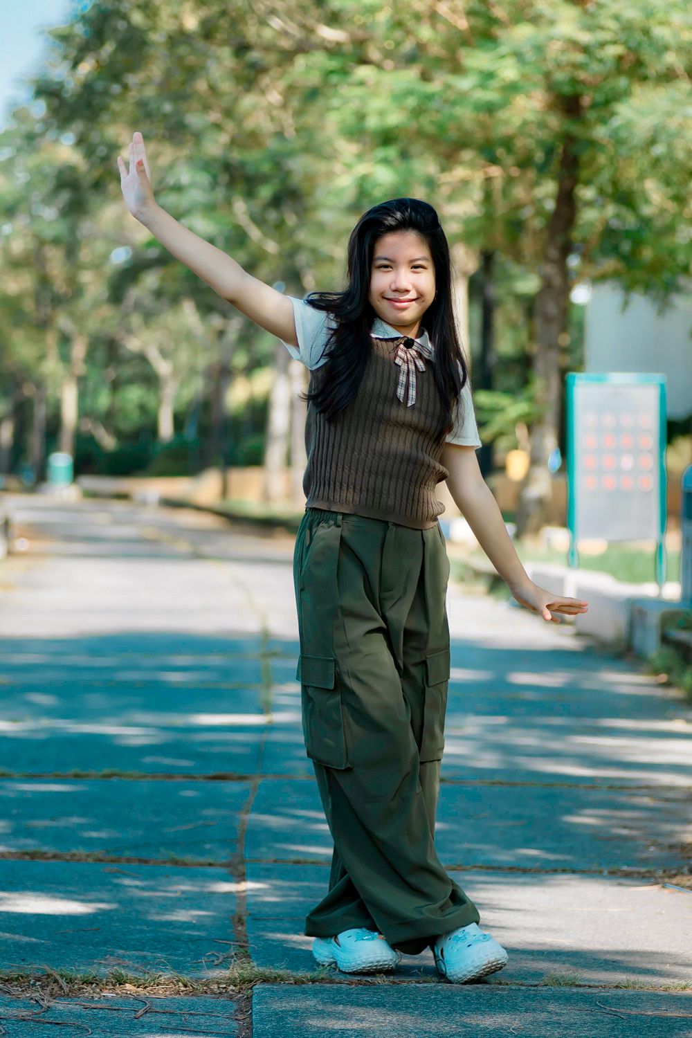 Young Girl Posing Outdoors in Casual Attire · Free Stock Photo