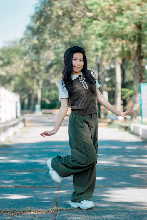 Young Girl Posing Outdoors in Casual Outfit · Free Stock Photo