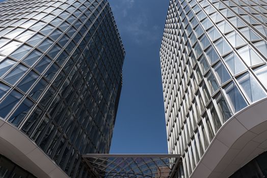 Modern architectural designs of glass facades in Hamburg's vibrant Hafencity area.