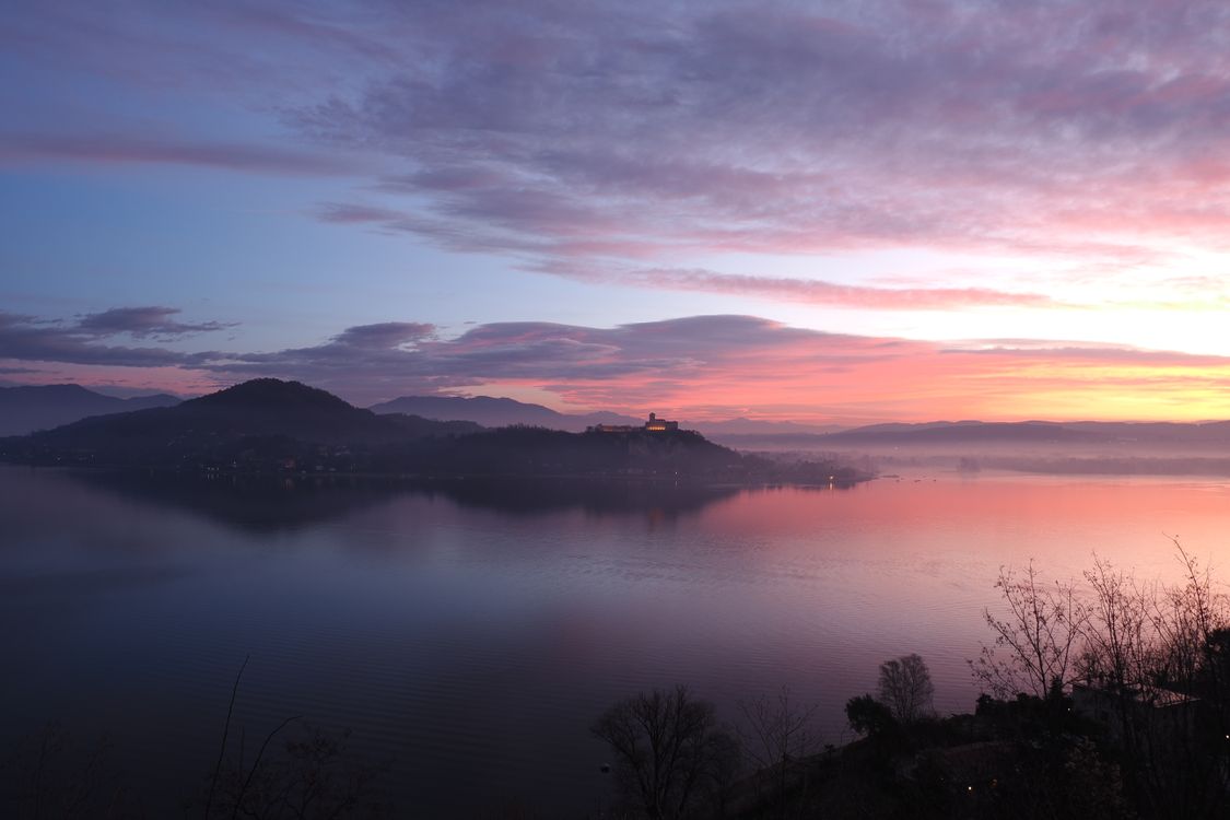 Serene Lake Landscape at Vibrant Sunset · Free Stock Photo