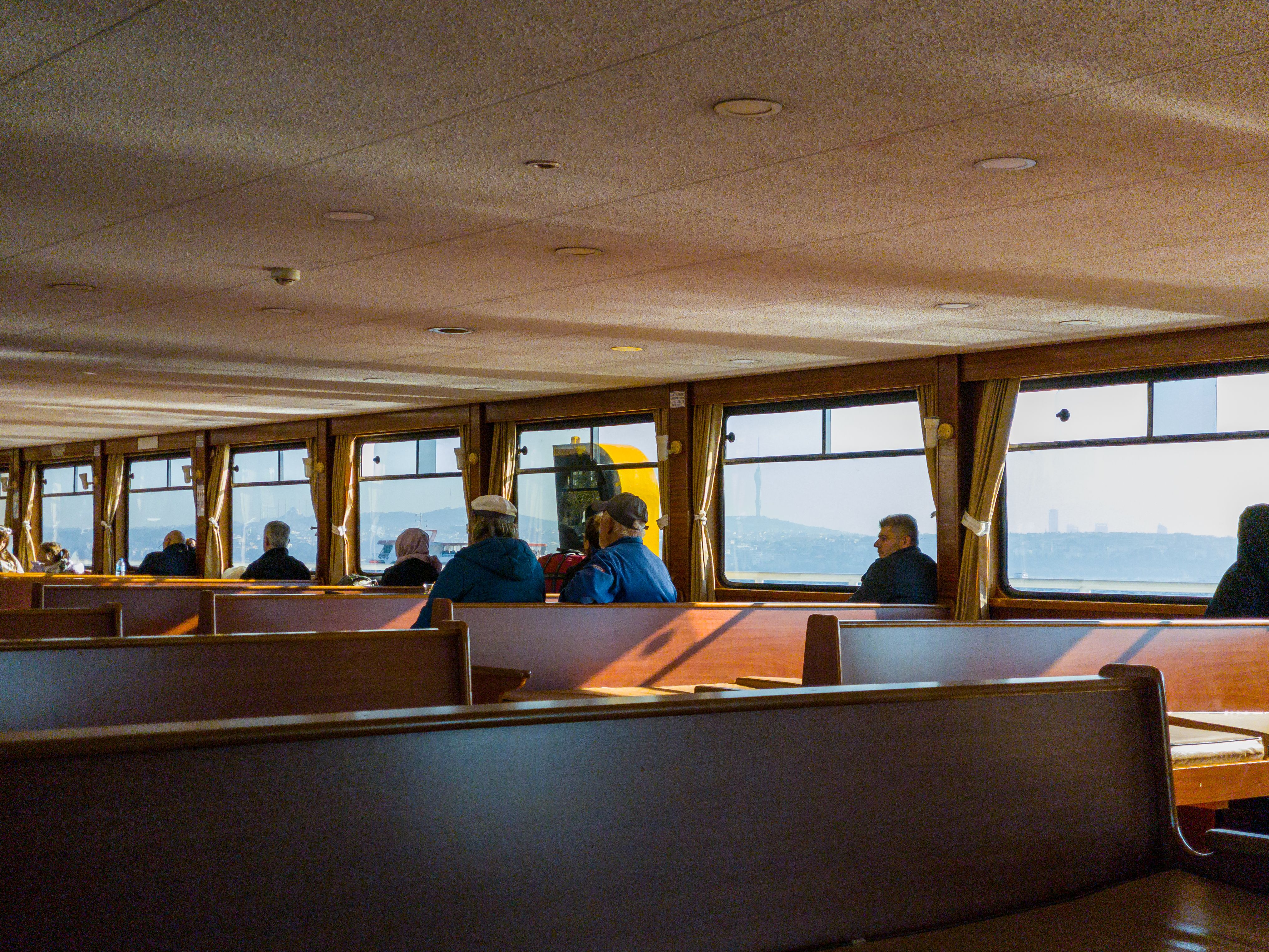 Passengers Relaxing on Scenic Ferry Ride · Free Stock Photo