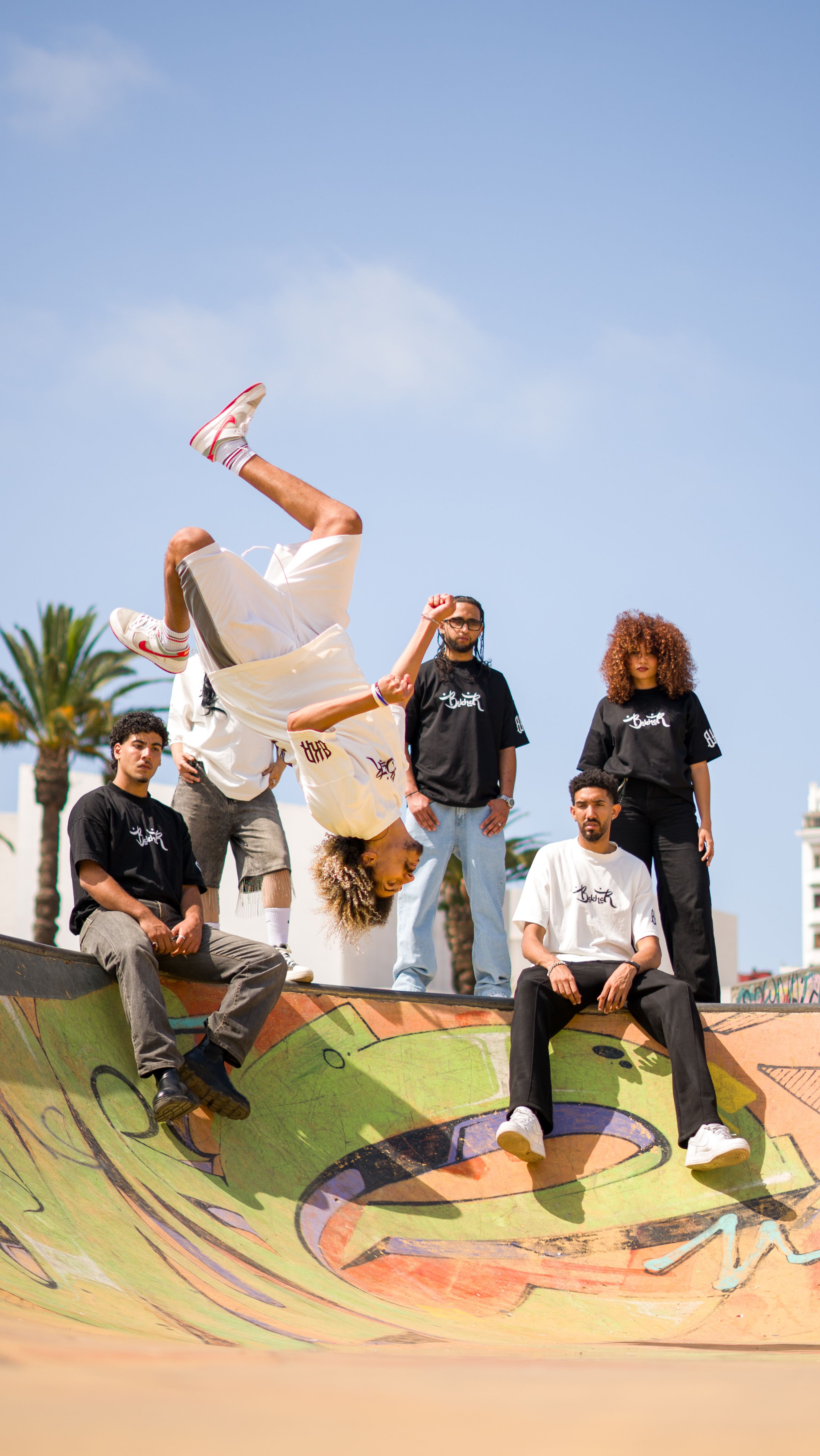 A vibrant shot of young skateboarders showcasing stunts at a skate park in Morocco.