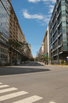 Explore the vibrant cityscape of Buenos Aires with this urban street view showcasing modern architecture.