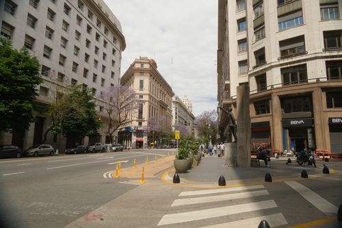 Free A vibrant street view in Buenos Aires, featuring classic architecture and urban life. Stock Photo