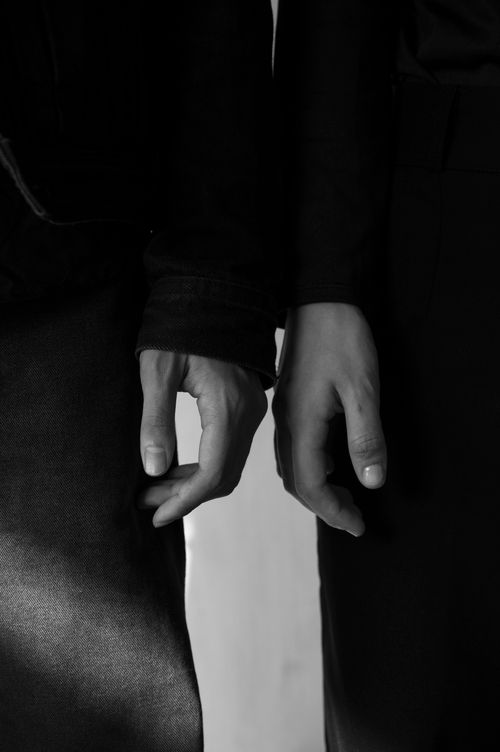 Free Elegant black and white photo of two touching hands, symbolizing connection and intimacy. Stock Photo