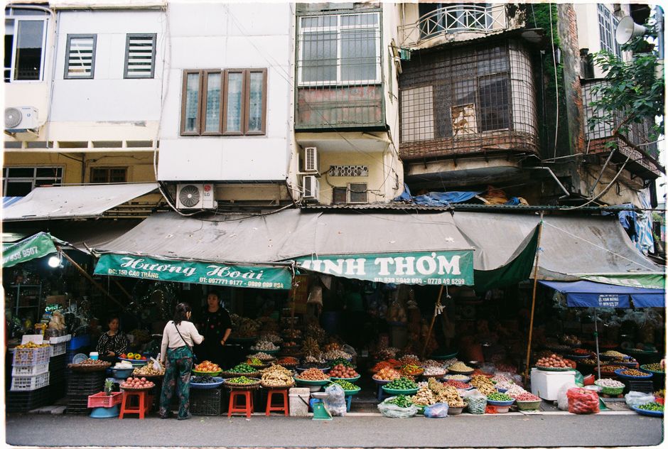 Vibrant street market in Vietnam offering fresh produce and local products.