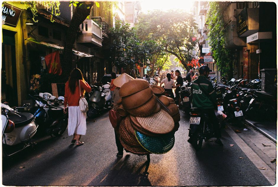 Busy street scene with motorbikes in Hanoi, Vietnam, illustrating the importance of motorcycle accident coverage.