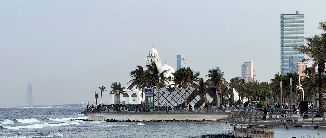 Morning view of Jeddah Corniche with palm trees and ocean waves, capturing Saudi Arabia's coastal beauty., Jeddah, Saudi Arabia, stay connected here with a travel eSIM