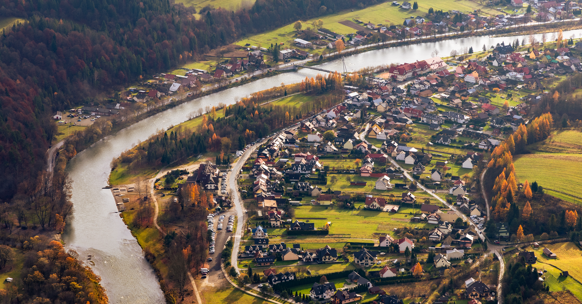 Fall Riverside Aerial View of Picturesque Riverside Village in Fall · Free Stock Photo