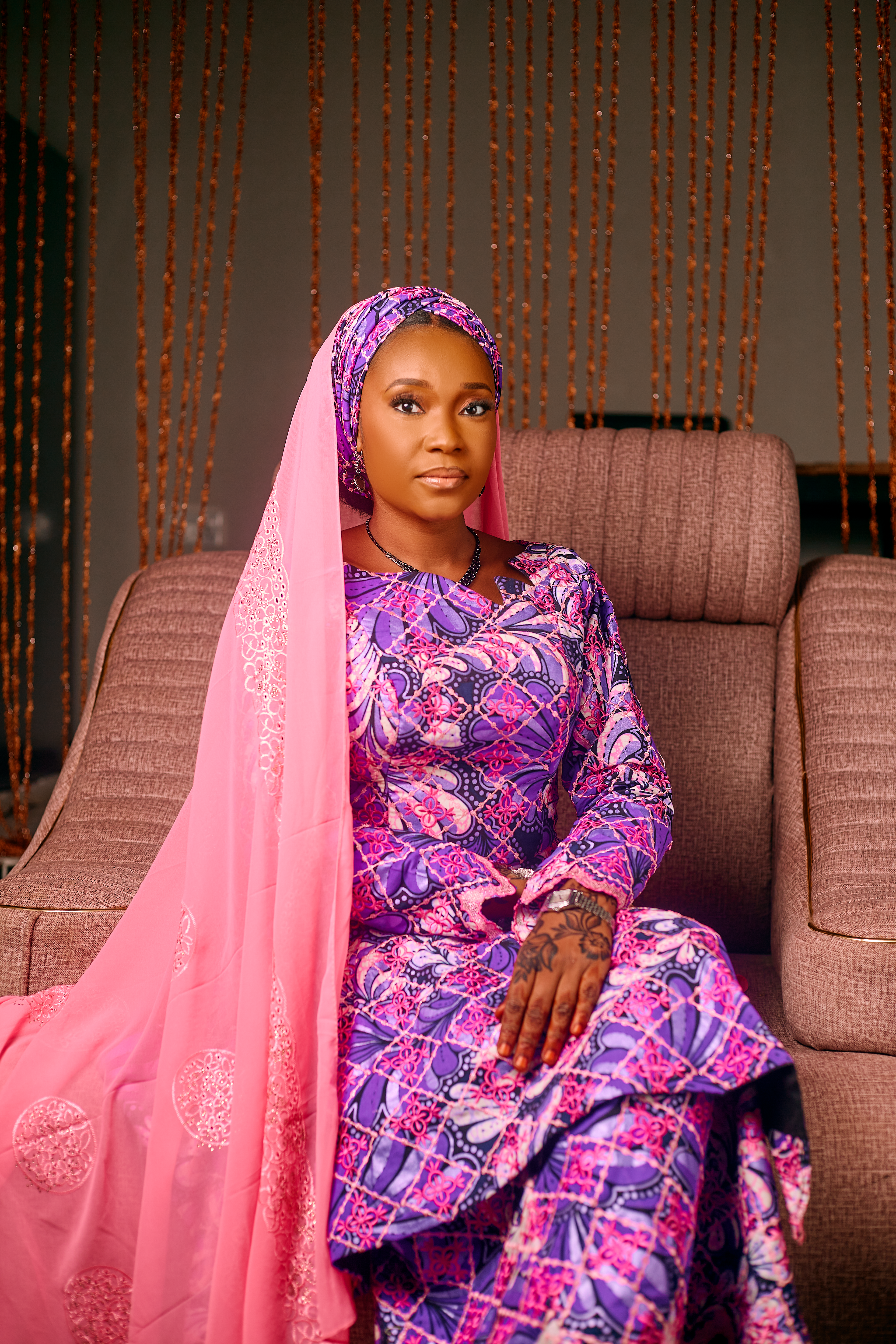 Elegant Woman in Traditional Vibrant Attire Indoors · Free Stock Photo