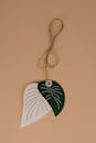 Ornamental Leaf Tag on Beige Background