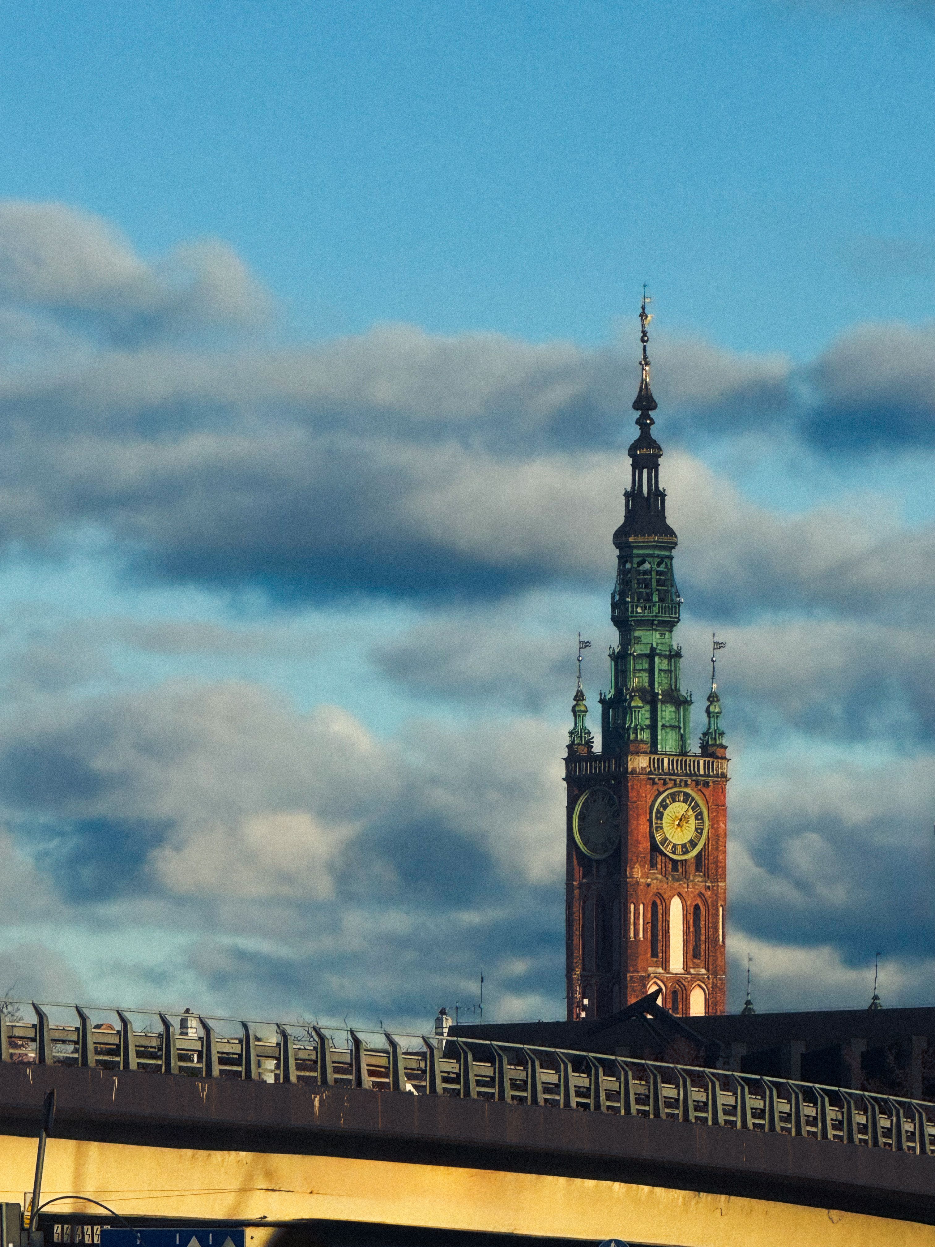 Historic Clock Tower Against Cloudy Sky · Free Stock Photo