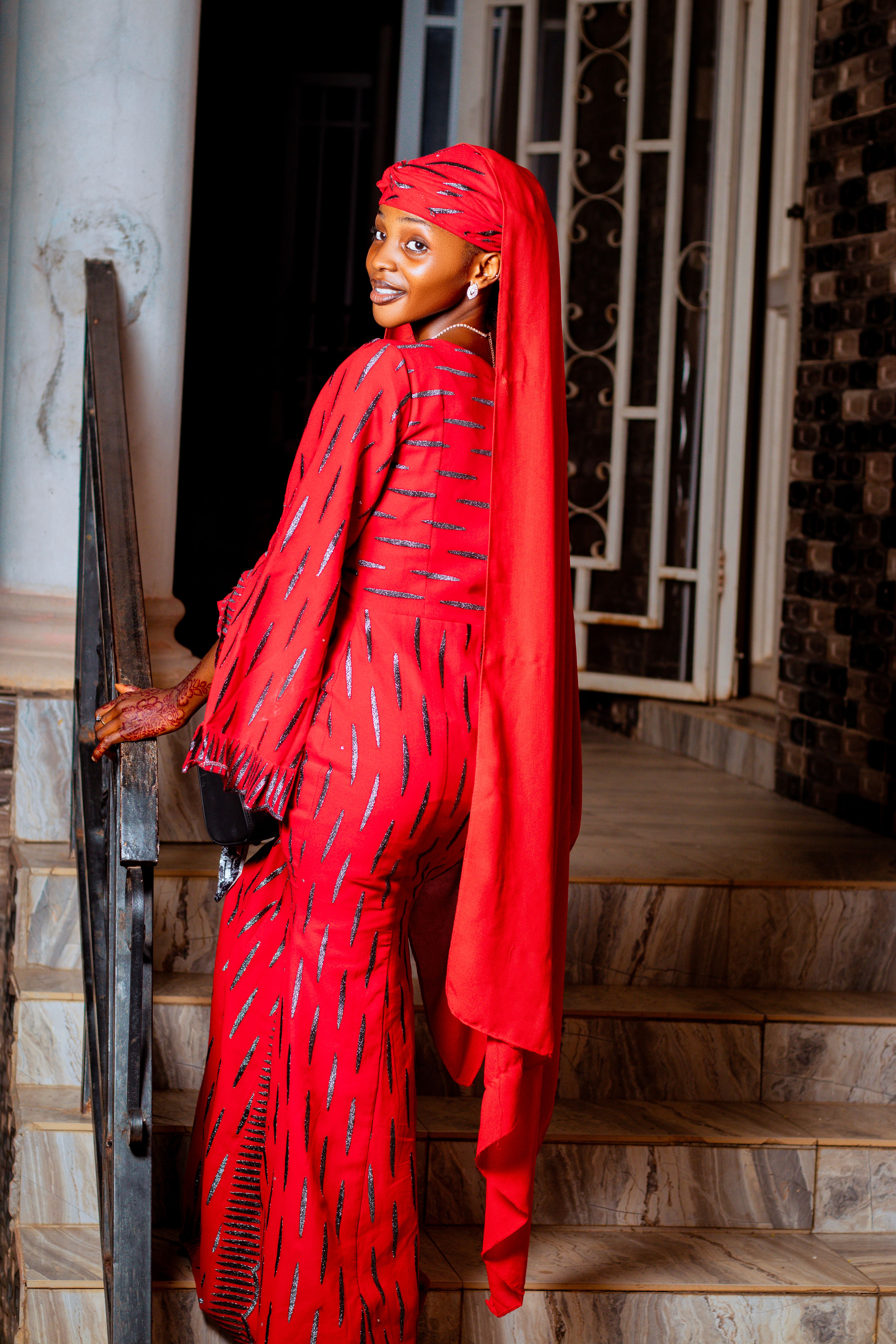 Elegant Woman in Vibrant Red Traditional Attire · Free Stock Photo