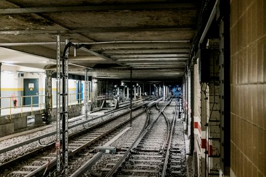 Explore the intricate Berlin subway system with this view of underground railway tracks.