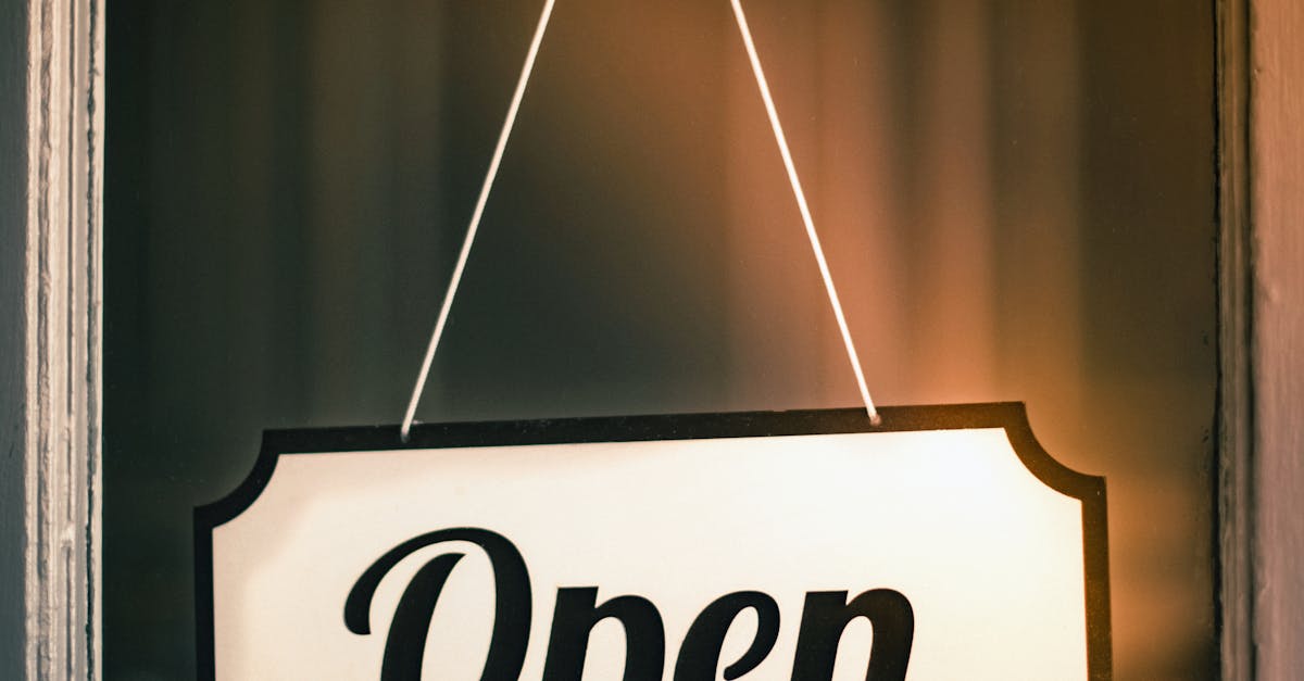 Photo by Tim Mossholder Vintage 'Open' sign hanging on a shop door signifying readiness for business.
