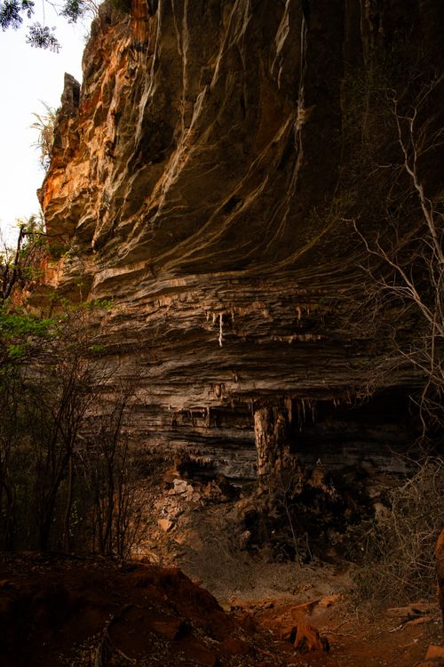 Free Explore the natural beauty of a sandstone cave with dramatic rock formations and stalactites. Stock Photo