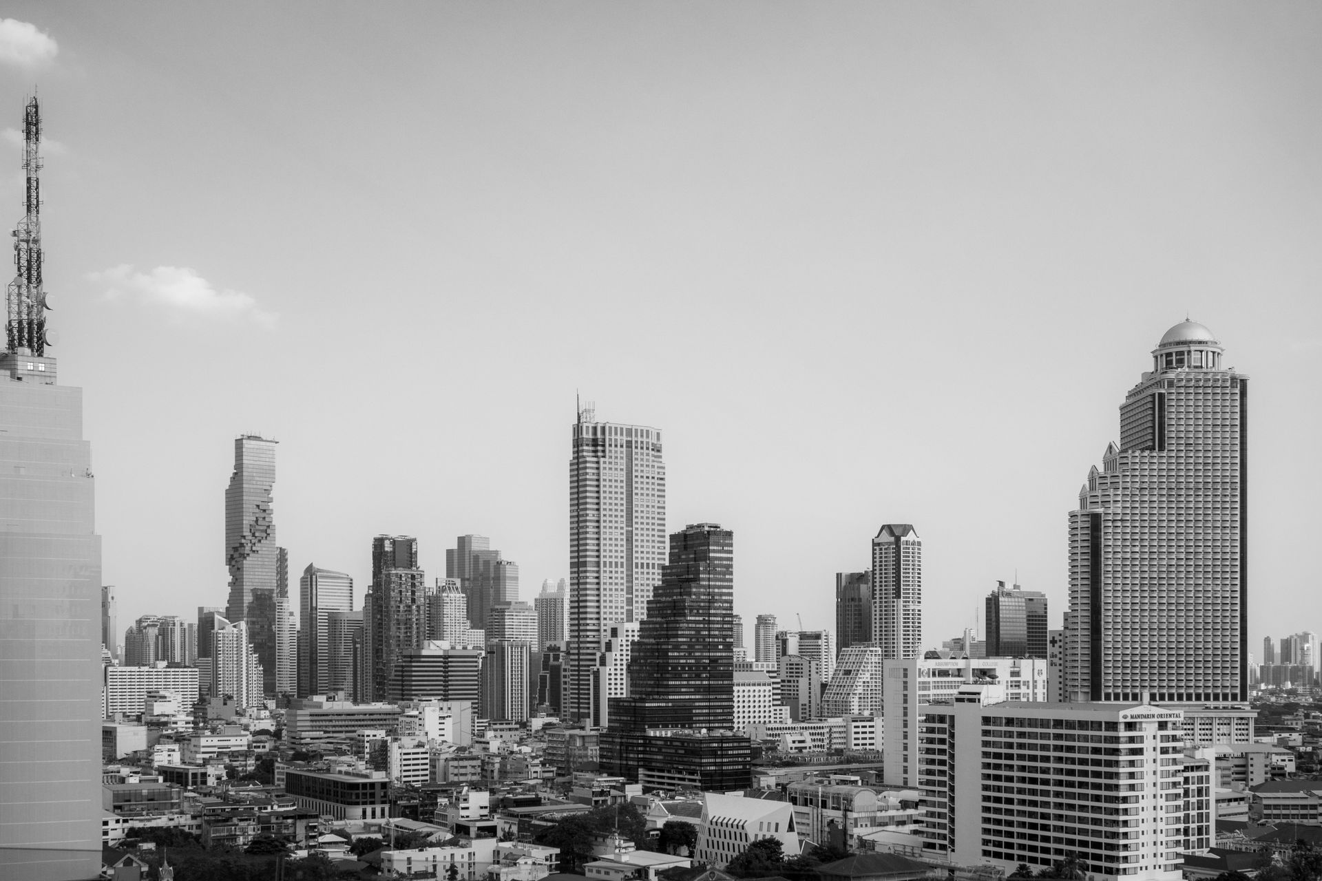 A stunning black and white view of Bangkok's towering skyline, highlighting modern architecture.