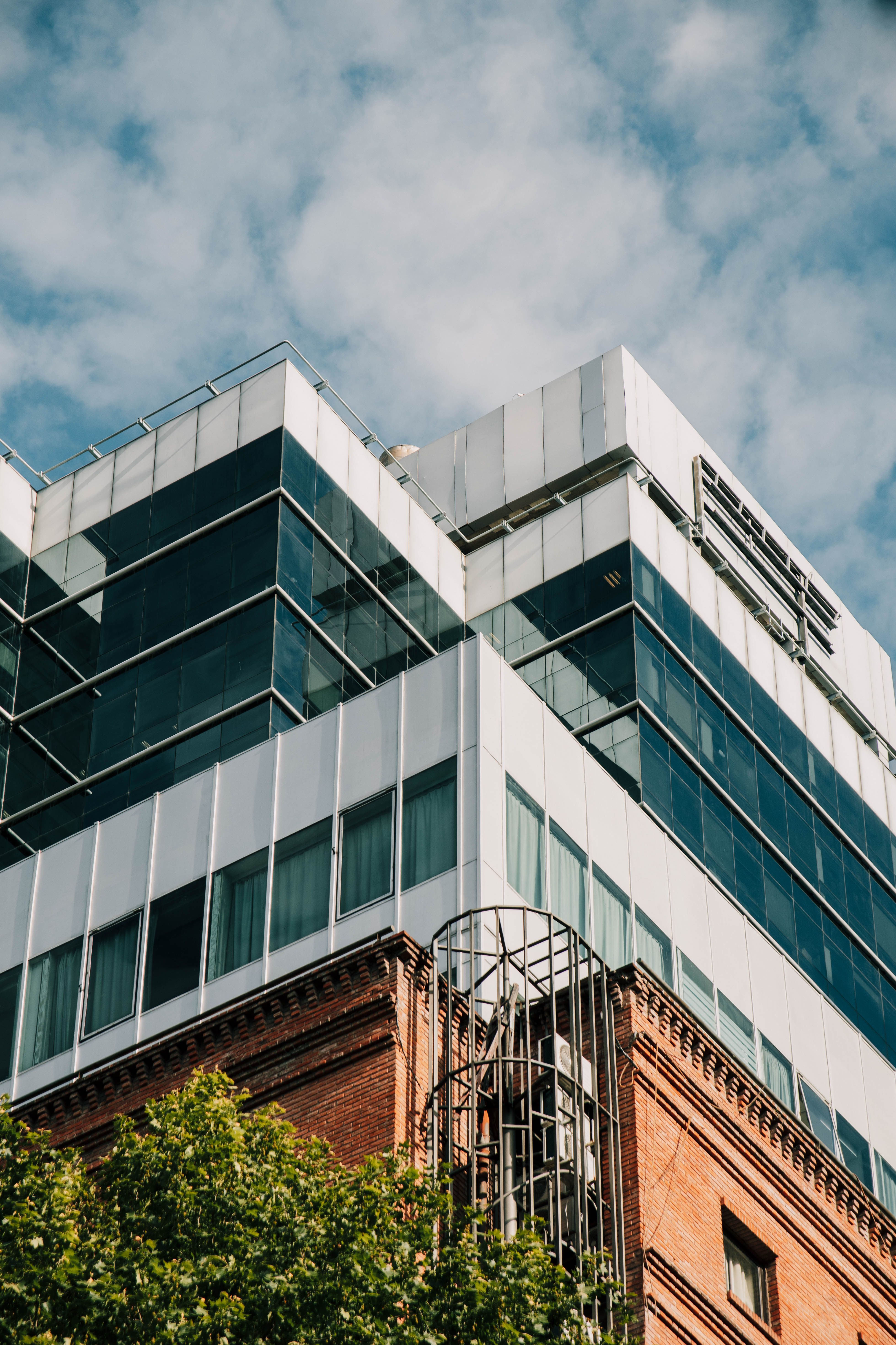 Modern Architectural Building with Glass Facade · Free Stock Photo